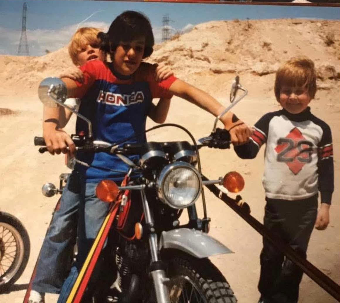 Damon Schuetze as a child on a motorcycle