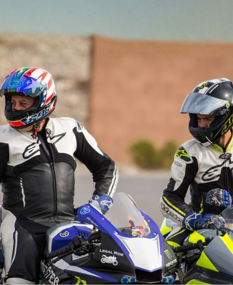 Legal Ride riders in helmets beside motorcycles